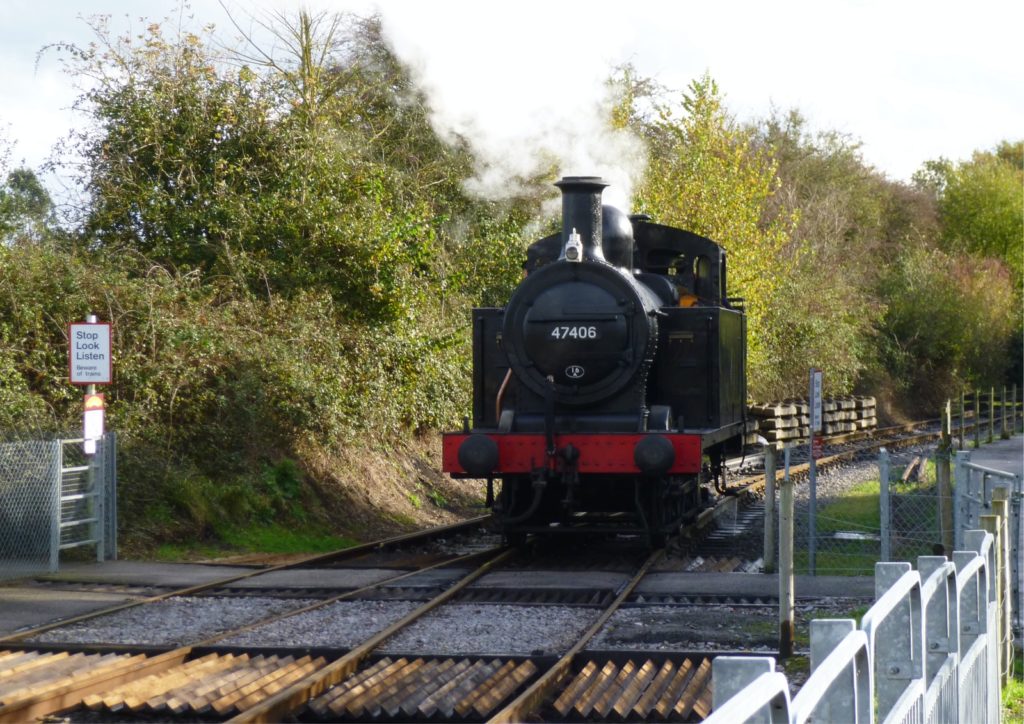 black and red train on rail tracks during daytime